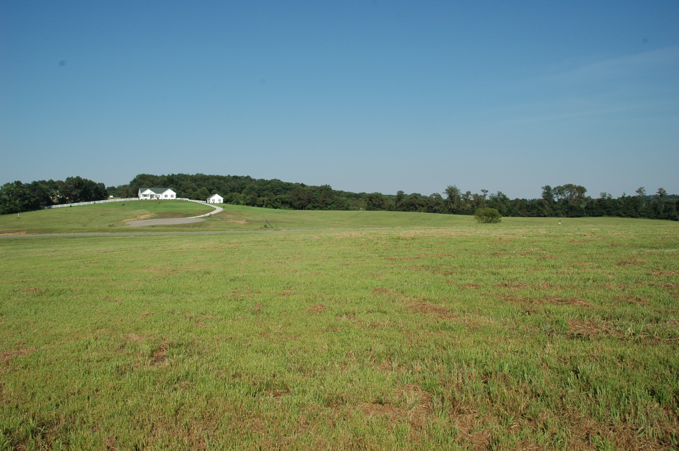 Mountain Meadow Drive with homes on the hilltop